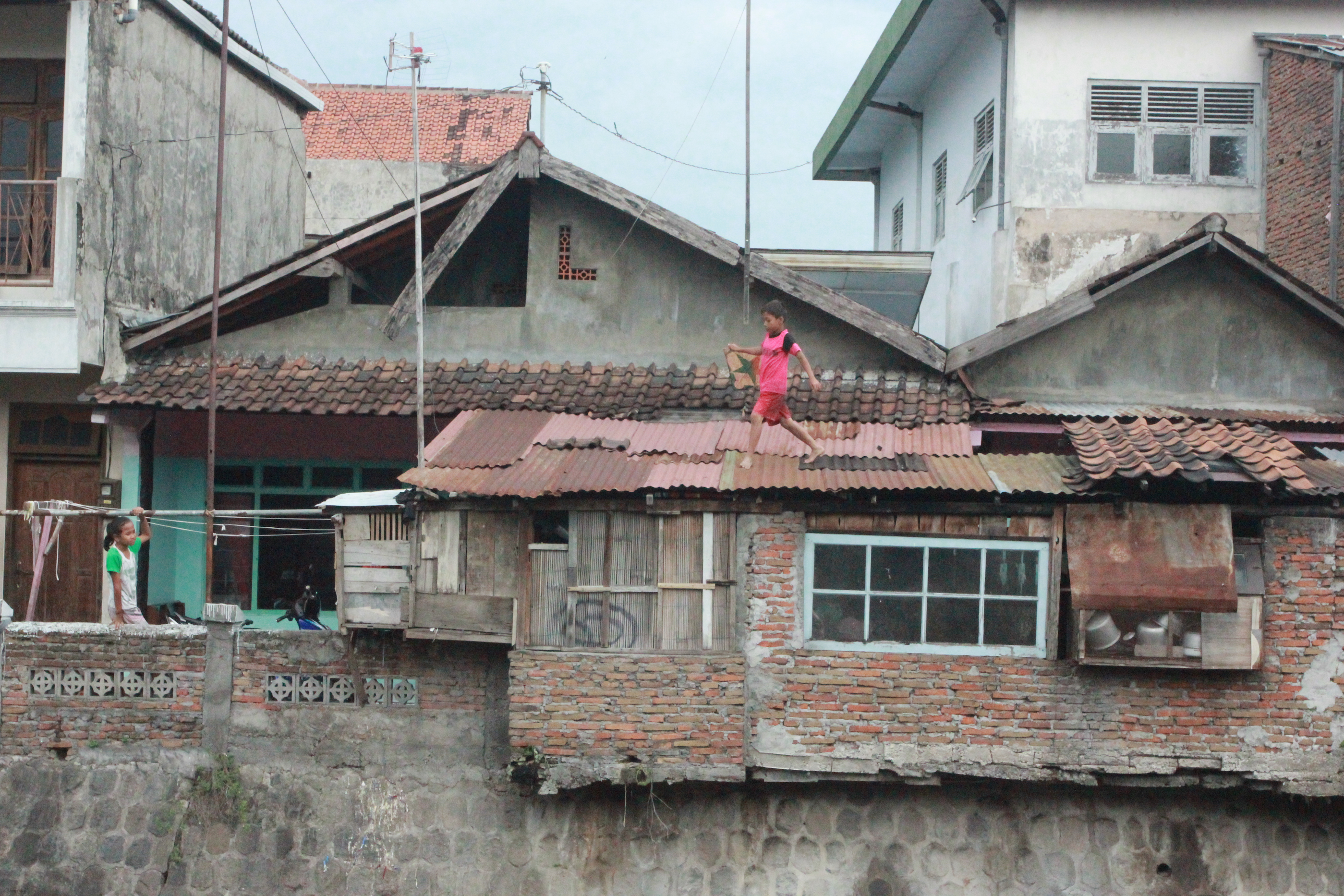 Boy walking on the roof 