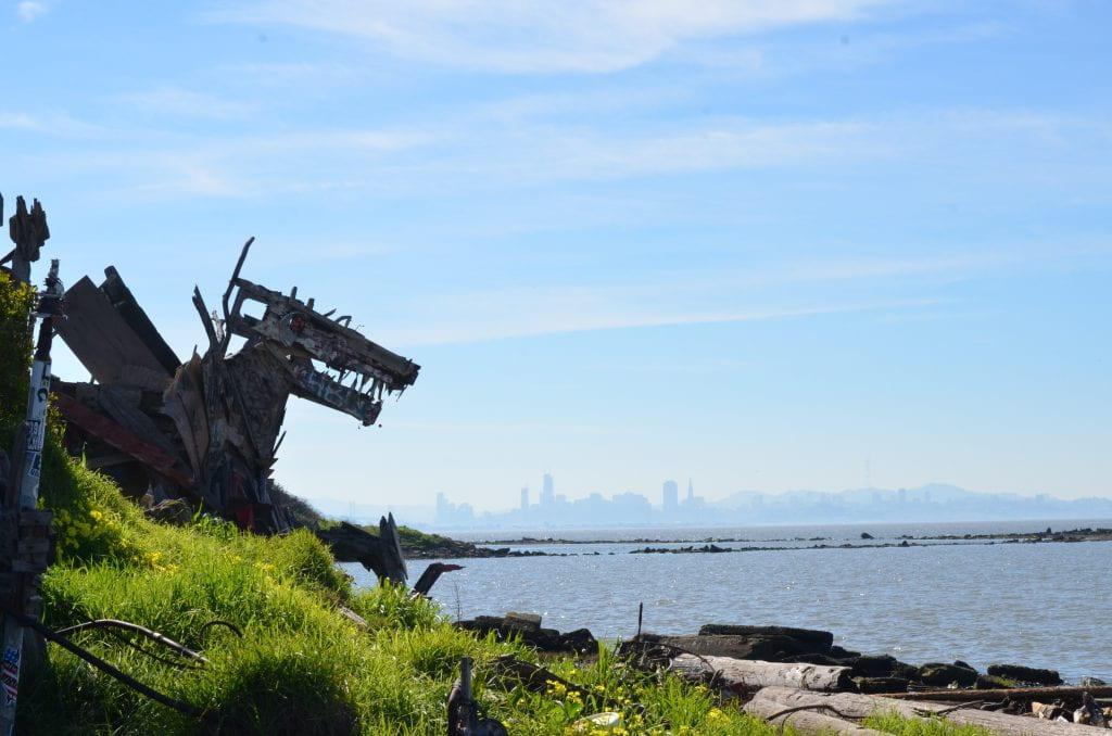 dragon sculpture in front of water body