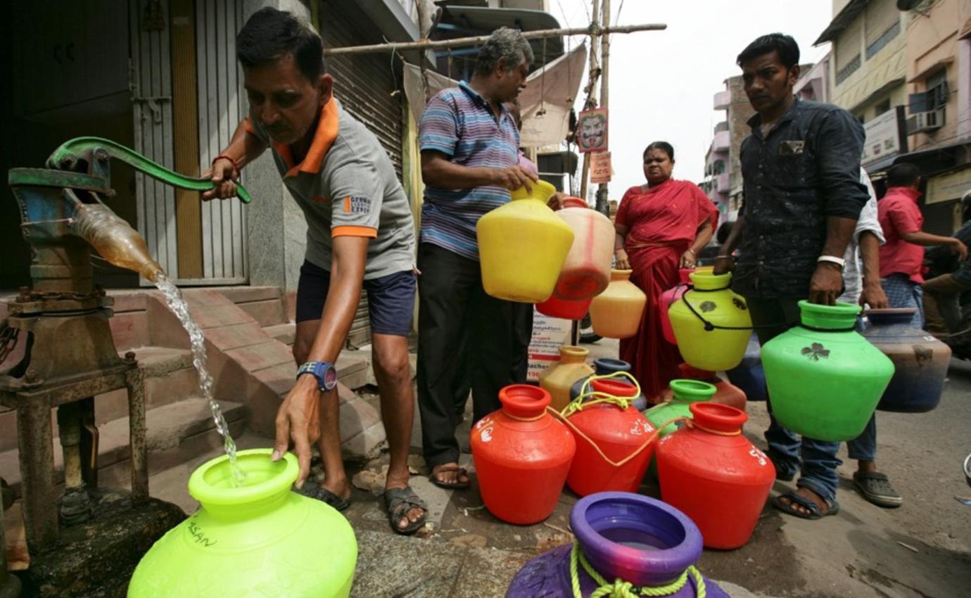 A man pumps drinking water during the water shortage in Chennai, India.